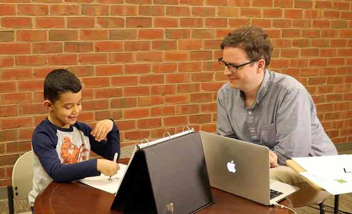 Teacher administering an progress-monitoring assessment