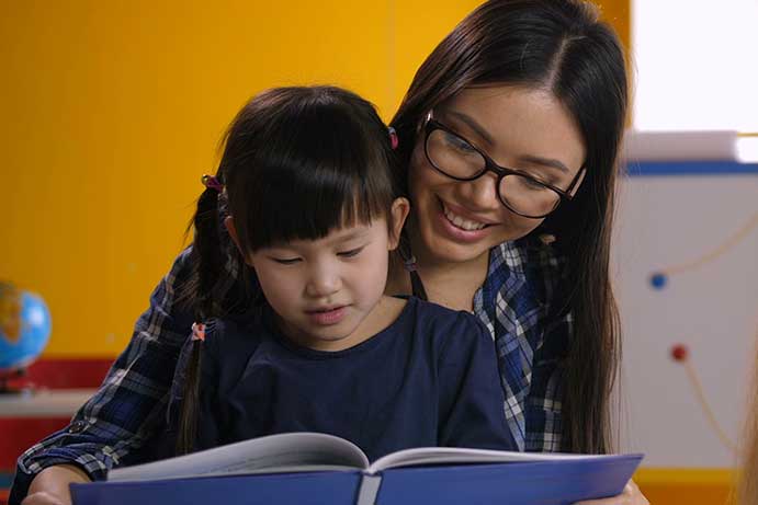 Mother and Child reading a book